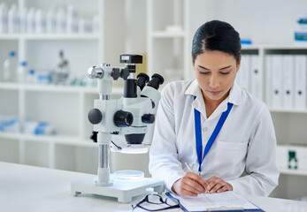 Documents, microscope and writing with science woman in laboratory for innovation or research....
