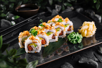 Gourmet sushi rolls with fresh toppings on elegant plate