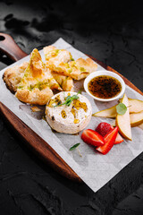 Gourmet baked brie with pear and strawberry