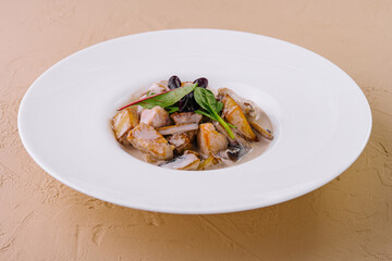 Creamy seafood delight on elegant white plate
