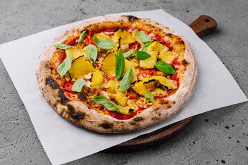 Fresh hawaiian pizza on wooden board