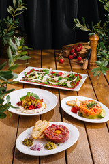 Gourmet salad trio on wooden table