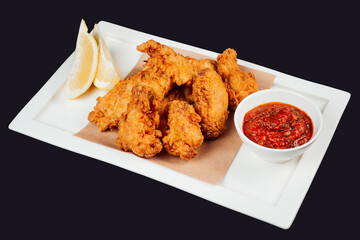 Crispy fried chicken wings with tangy dip
