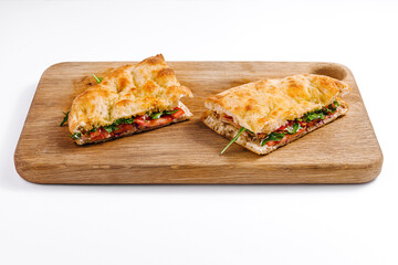 Fresh italian panini sandwich on wooden board