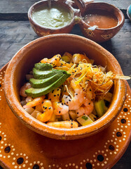 Delicious traditional mexican ceviche. The Caribbean ceviche with prawn, mango, avocado.