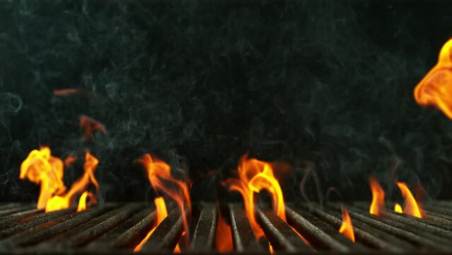Super slow motion of flames with empty grill grid. Filmed on high speed cinema camera, 1000 fps. Isolated on black background.