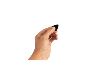 Black male hand holding a guitar pick isolated no background