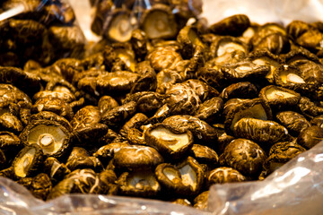 a close-up view of numerous dried shiitake mushrooms