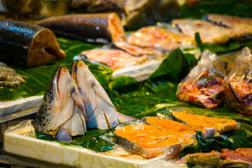 fresh salmon heads on a fish stall