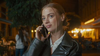 European young woman talking chatting gossiping mobile phone smartphone cellphone friendship...