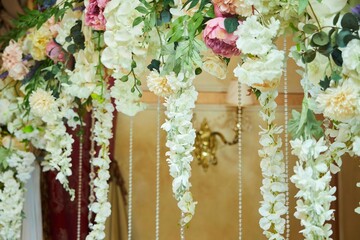 Decor for a wedding or engagement party. Close-up of floristry, flowers and decorative elements.