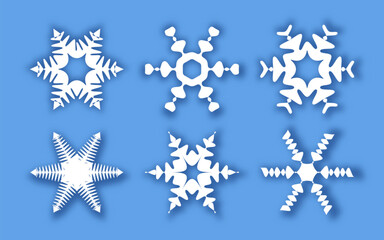 Snowflakes of different shapes on a blue background. Vector illustration