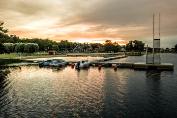 Naklejka premium sunset over the lake in Estonia, boats in harbour