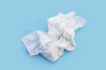 Facial tissue on blue background.