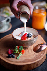 Musli for breakfast with yogurt and berries