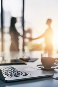 Handshake, laptop and office with lens flare, crm and thank you with greeting and welcome of staff. Tech, business people and working at a company in the morning at meeting with computer and b2b