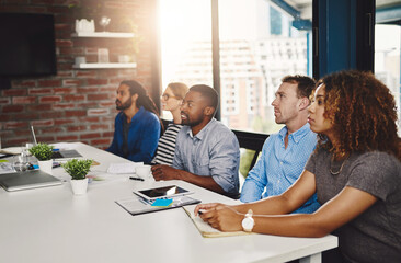 Meeting, row and presentation for coworkers, boardroom and lens flare in office. Seminar, conference and learn for creative agency people, diverse and employees for discussion in workshop