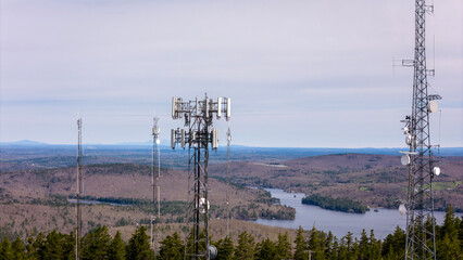 A series of radio, TV and cell towers on top of a mountain in Maine