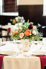 Elegant table setting with floral centerpiece and table number