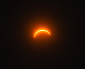 Solar eclipse 2024 with moon almost totally covering the sun.