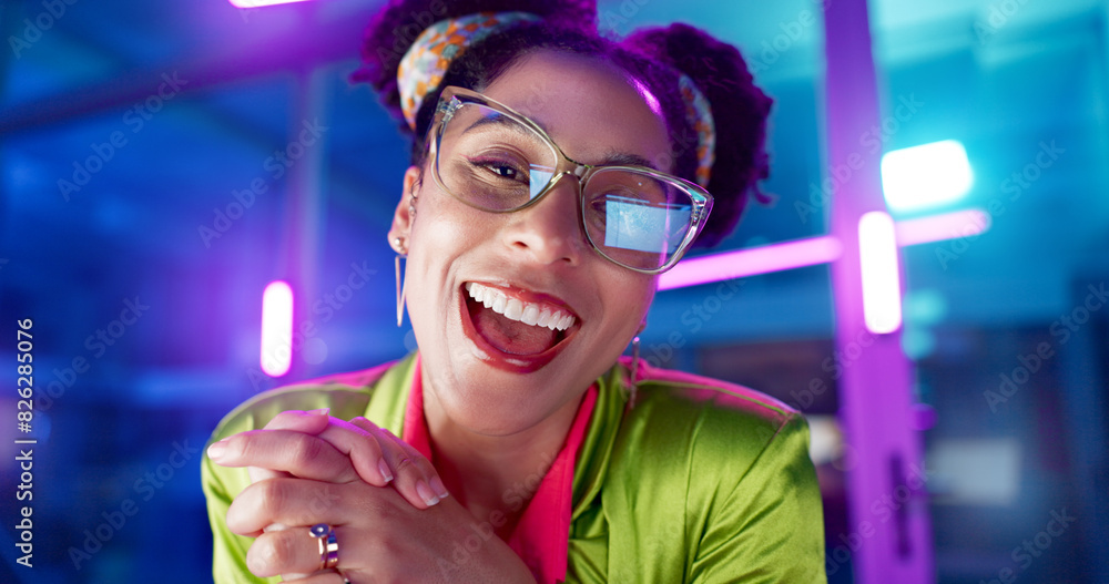 Poster Face, computer and neon with programmer woman in office at night for coding or developing. Portrait, smile or happy young game developer sitting at desk in workplace with virtual system update