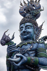 Deity statues at the Blue Temple of Chiang Rai, Thailand
