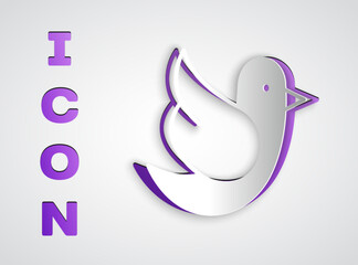 Paper cut Dove icon isolated on grey background. Paper art style. Vector