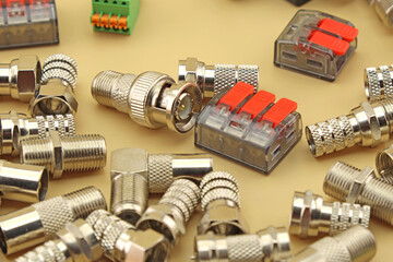 Metal connectors for connecting coaxial cable. Close-up. Soft focus.