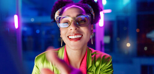 Woman, night and smile in office with neon, tablet and glasses for reading, information technology...