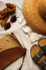 White blouse, straw hat, flat sansdals, tortoiseshell sunglasses, polka dot scrunchie, wicker bag...