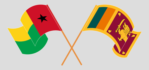 Crossed and waving flags of Guinea-Bissau and Sri Lanka