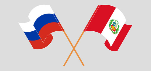 Crossed and waving flags of Russia and Peru