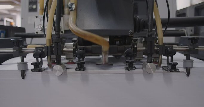 Offset printing machine in printing house with blur background