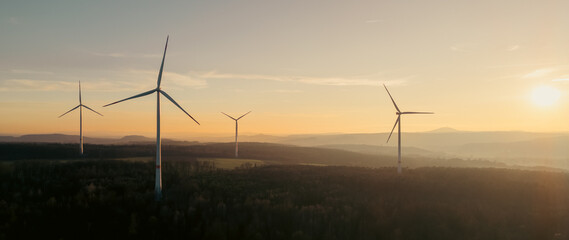 wind turbines generating for the production of green energy in the sun