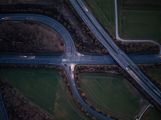 an aerial view of a highway and some trees in a country