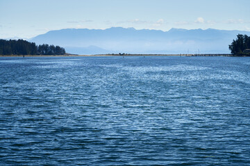 A beautiful view from the Rotary Walkway in Sooke over the deep blue ocean towards Whiffin Spit