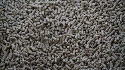 Closeup shot of a pile of grained wood pellets, perfect for food preparation