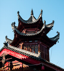 Obraz premium Traditional Chinese brick and wood architecture under sunlight in Wuhan, China.