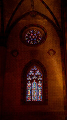 Fototapeta premium Vertical shot of beautiful stained glass windows in the Toulouse Cathedral
