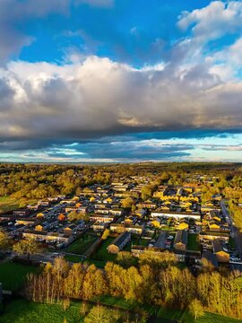 Vertical time-lapse of clouds drifting over the cityscape.