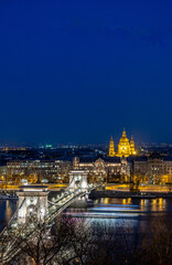 Aerial view of the Chain Bridge over the Danube River in Budapest in the evening.