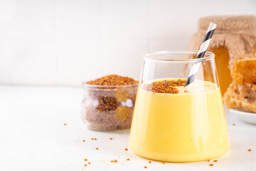 Bee pollen dish, creamy warm or cold shake smoothie golden colored drink