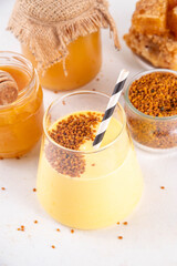 Bee pollen dish, creamy warm or cold shake smoothie golden colored drink