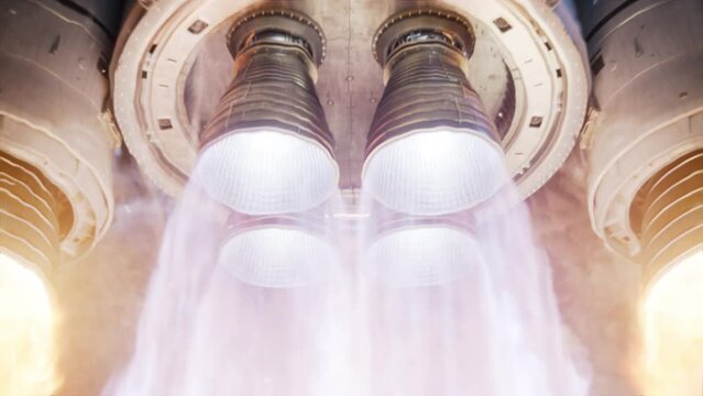 Large Rocket Engine Ignition. Powerful and Hot Flames Burst out of the Nozzle after Initial Impulse. Rocket Launch at Night. Vertical Takeoff of Large Space Exploration Rocket with Boosters. 