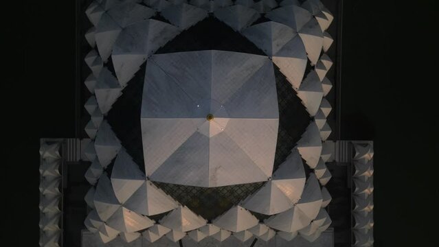 Top down rotating drone shot of Masjid Raya Al Jabbar at sunset in Bandung, West Java, Indonesia