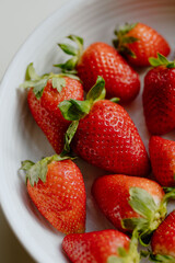 Bowl of fresh strawberries on a table