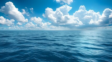 Obraz premium Blue sky and sea, blue ocean water, white clouds, clear horizon line, beautiful scenery, tranquil atmosphere. 