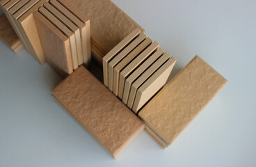 Columns of stacked tiles for facing internal surfaces. Stock Photo For Storage Theme Illustration 
