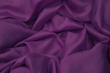 Closeup of purple silk cloth fabric.