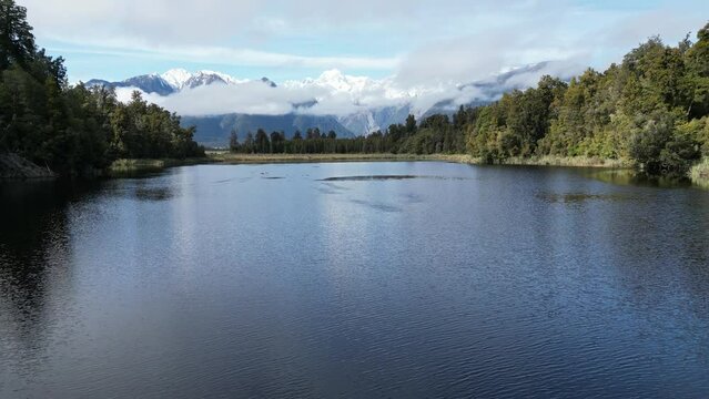 Drone footage of waterbirds taking off from the Glacier Lake Matheson in South Westland, New Zealand